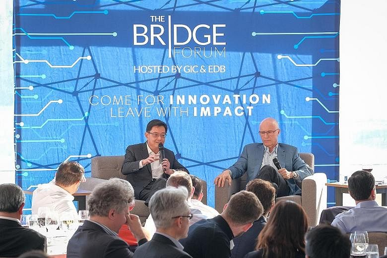 Finance Minister Heng Swee Keat, seen here with Sequoia Capital managing partner Doug Leone at the Bridge Forum CEO Summit in San Francisco on Wednesday, said he hoped Singapore can serve as Asia 101 for global companies seeking to get into Asia. PHO