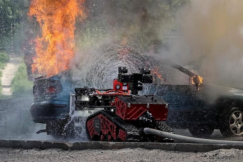 Colossus, a fire-fighting robot, taking part in a drill in 2017. It is said to have lowered temperatures in Notre-Dame's glass-filled nave and saved the lives of French firefighters in the Monday fire. PHOTO: AGENCE FRANCE-PRESSE