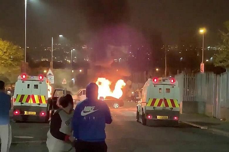 A video screenshot showing vehicles set on fire during the riots in Londonderry, Northern Ireland on Thursday. Rioting erupted in the Irish nationalist Creggan area of the city after a raid by police, who said they were trying to prevent militant att