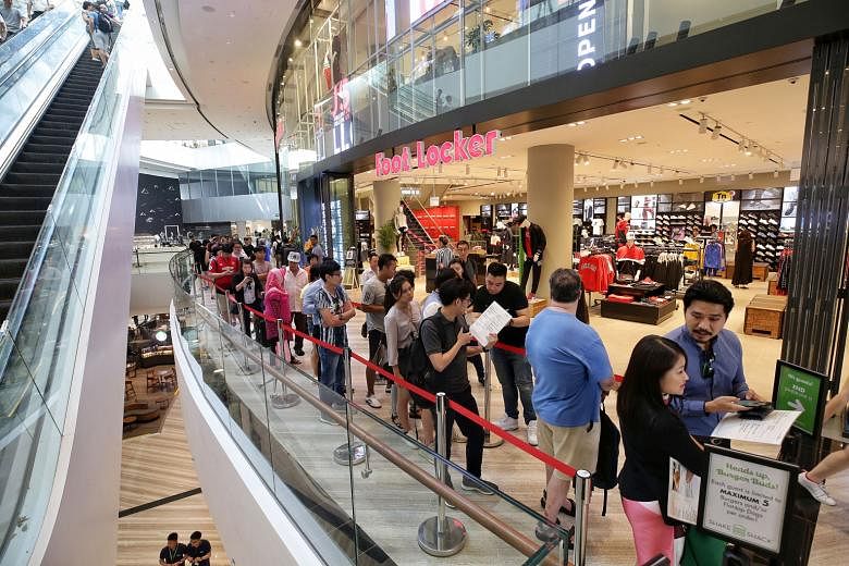 Mr Justin Zheng, who works in the aviation industry, was the first person in the queue outside Shake Shack (above) when it opened at Jewel Changi Airport on Wednesday. Queueing service provider iQueue was hired by a radio station to buy food from the burg