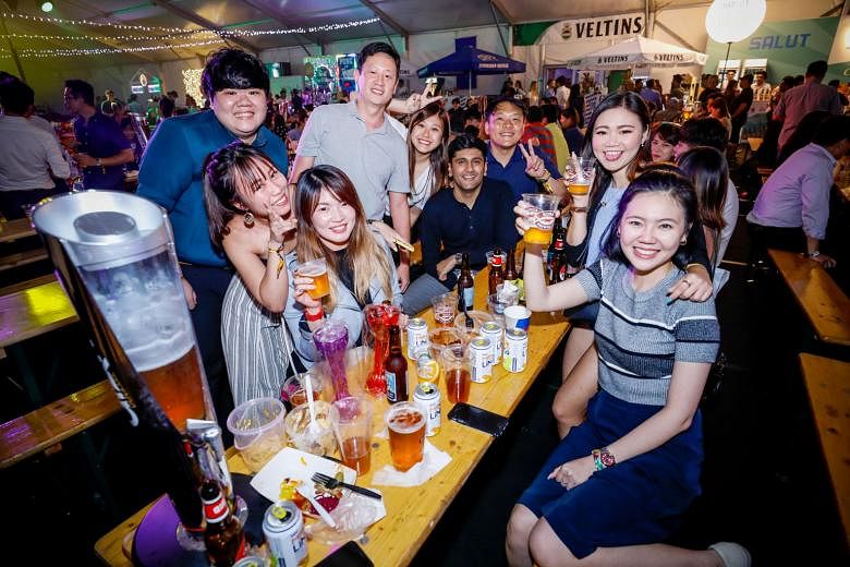 Patrons making a toast at Beerfest Asia last year. This year's edition offers more than 600 beers and marks the debut of the Beerfest Run.