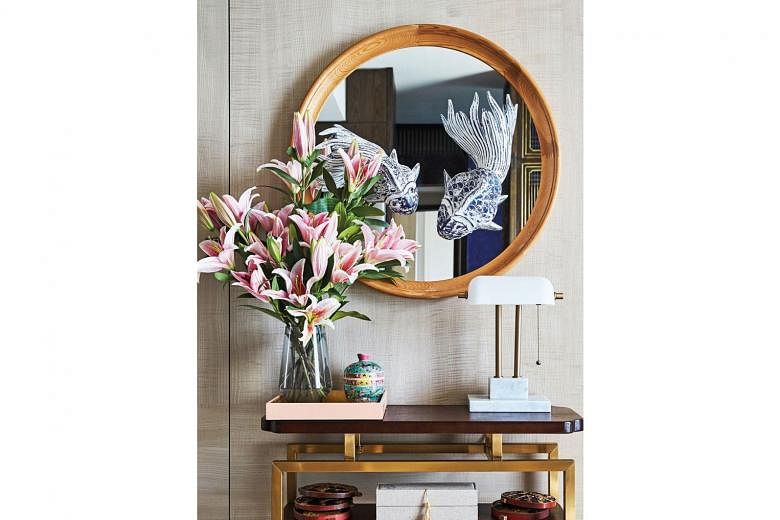 A D-I-Y mirror feature near the entrance foyer adds an interesting visual to the home. 