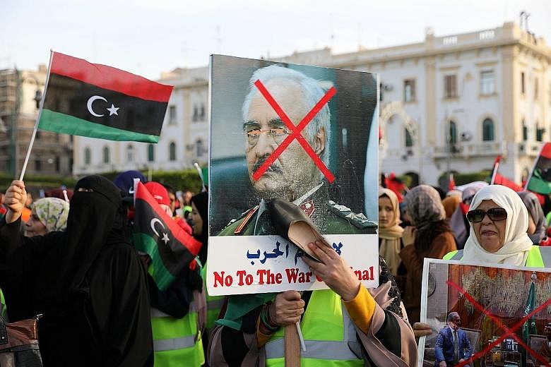 Libyan protesters attending a demonstration in Martyrs' Square last Friday to demand an end to Mr Khalifa Haftar's offensive against Tripoli. The Libyan strongman enjoys the support of Egypt, Saudi Arabia, the United Arab Emirates, Russia and now, th