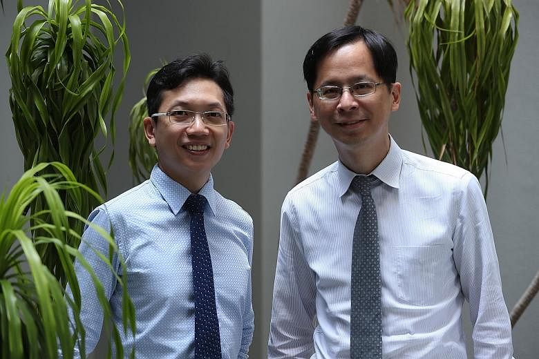The study's main author Tham Yih Chung (left), a clinical research fellow at the Singapore Eye Research Institute's ocular epidemiology unit, with Professor Cheng Ching-Yu, the unit's head. The main causes of vision-related cognitive impairment are l