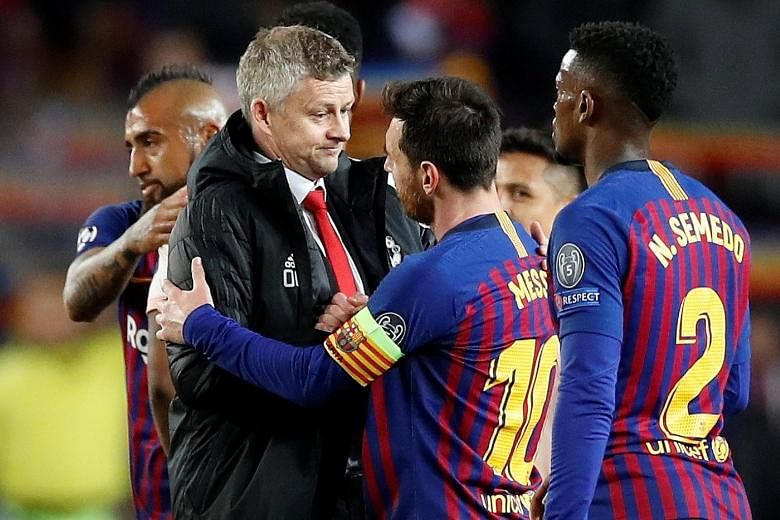 Manchester United manager Ole Gunnar Solskjaer (with Lionel Messi after bowing out to Barcelona 4-0 on aggregate in the Champions League quarter-finals) has "five games to see if we can finish it off". PHOTO: REUTERS