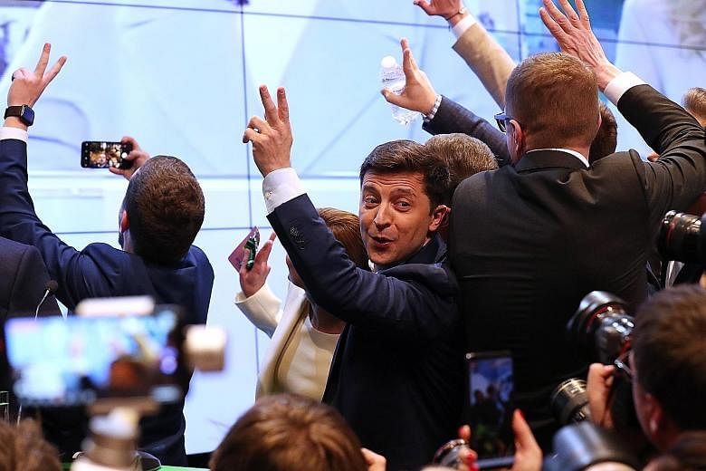 Stand-up comedian and television star Volodymyr Zelensky reacting to the announcement of exit-poll results in Kiev on Sunday.