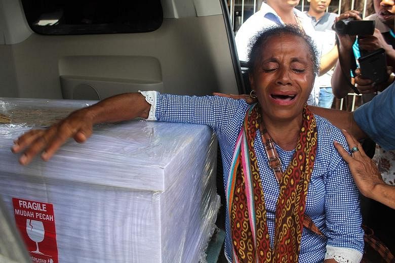 Ms Petronela Koa in tears on Feb 17 last year when the coffin containing her niece Adelina Sau arrived in East Nusa Tenggara. Ms Sau was found outside her employer's home covered with wounds. She died in hospital.