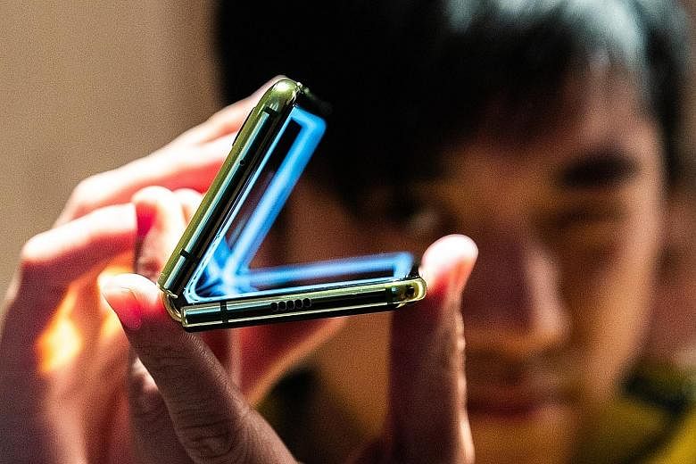 The Galaxy Fold handset has been blighted by technology journalists' reports of breaks, bulges and blinking screens after using their samples for as short a period as a day. PHOTO: BLOOMBERG