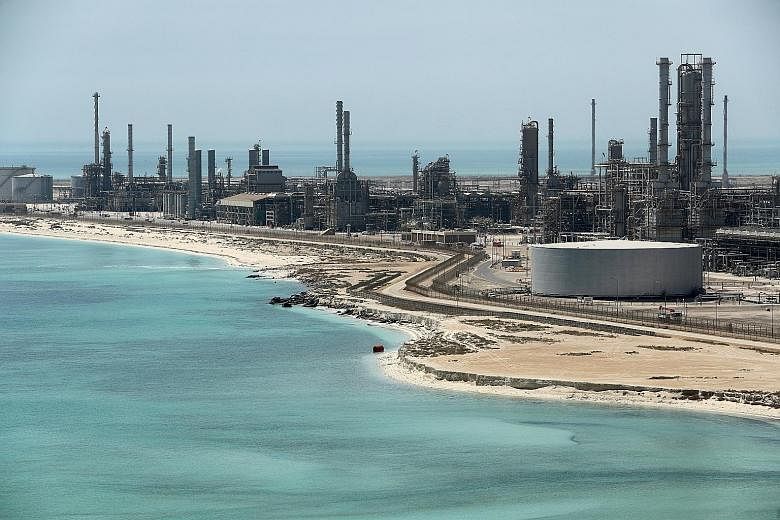 Saudi Aramco's Ras Tanura oil refinery in Saudi Arabia. Oil has rallied almost 40 per cent this year as the Organisation of Petroleum Exporting Countries and its allies continued their commitment to curb output in a bid to avert a glut. Yesterday, an