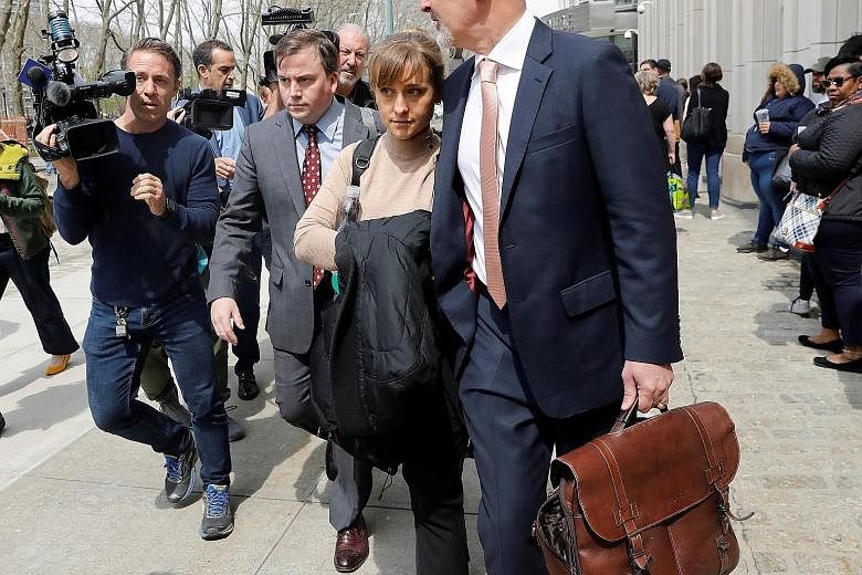 Actress Allison Mack leaving the Brooklyn Federal Courthouse after facing charges regarding sex trafficking and racketeering related to the NXIVM cult case in New York.