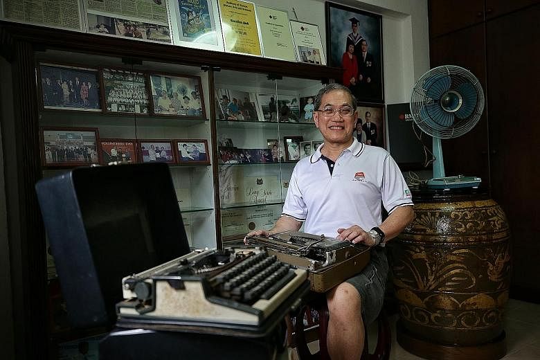 Mr Mok Loi Wong, 65, with his memorabilia from yesteryear - old typewriters, an electric fan and earthenware. Born in 1953 in a kampung in Jalan Ubi, Mr Mok grew up in a wooden hut with an earthen floor and no electricity, and spent most of his free 