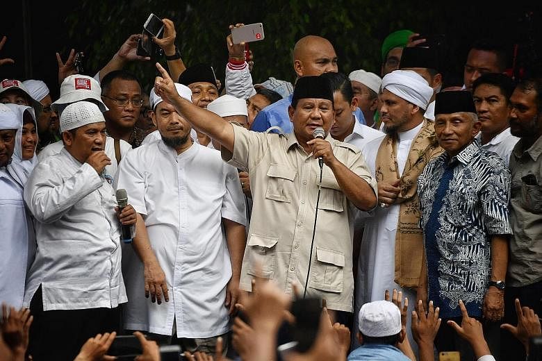 Presidential hopeful Prabowo Subianto, speaking to supporters outside his Jakarta residence last Friday, is dismissing unofficial quick counts and claiming he has won the election before the election commission has announced official results.