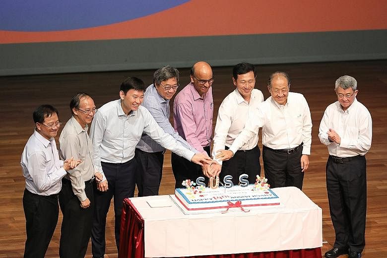 Attending the Singapore University of Social Sciences' 14th anniversary celebration yesterday were (from left): Institute for Adult Learning executive director Lee Wing On; SUSS president Cheong Hee Kiat; Senior Minister of State for Education Chee H