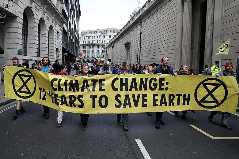 Protesters blocking traffic outside the Bank of England during the Extinction Rebellion protest in London yesterday.