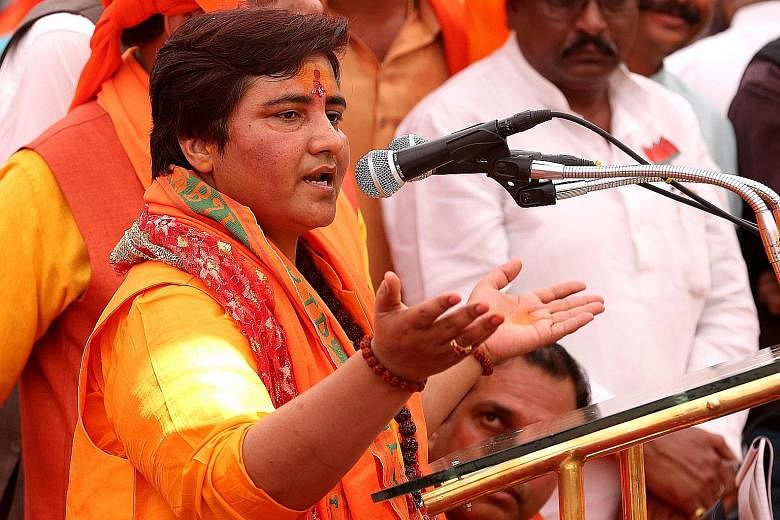 Sadhvi Pragya Thakur giving an address in Bhopal, Madhya Pradesh state, on Tuesday. Those who follow politics in the Indian state say the ruling Bharatiya Janata Party's choice of Ms Thakur in Bhopal has not gone down well with some in the local part
