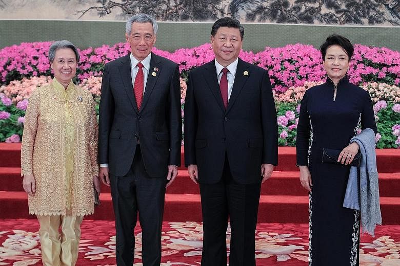 Prime Minister Lee Hsien Loong and Mrs Lee (far left) were among the foreign leaders and their spouses hosted to a welcome banquet by Chinese President Xi Jinping and his wife Peng Liyuan. PHOTO: MINISTRY OF COMMUNICATIONS AND INFORMATION