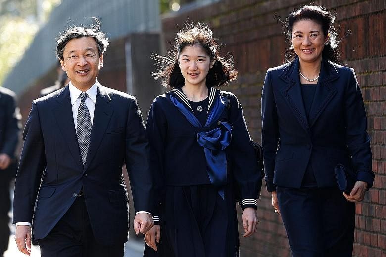 Princess Aiko with her parents, Crown Prince Naruhito and Crown Princess Masako, arriving at her graduation ceremony at Gakushuin Girls' Junior High School in Tokyo in 2017. On Wednesday, Crown Prince Naruhito will succeed his father, Emperor Akihito