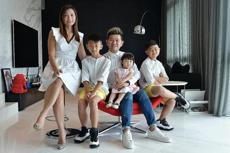 PropNex Realty associate senior group district division director Kelvin Thong, his wife Anne Koh, and their children - (from left) Xavier, Tiffany and Cayden. The family lives in a 2,637 sq ft five-bedroom duplex penthouse at Botannia in West Coast P