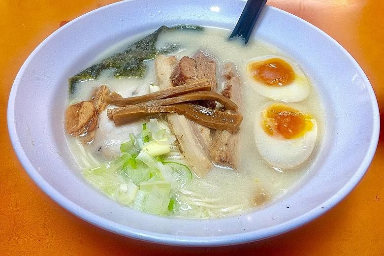 The deluxe tonkotsu-based version with onsen egg, pork and chicken chashu, scallions and seaweed.