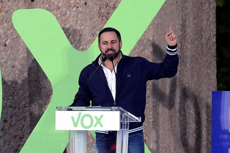 Mr Santiago Abascal (left), leader of right-wing party Vox, delivering a speech in Madrid on Friday, ahead of Spain's general election today. His rivals include Spanish Prime Minister Pedro Sanchez (right) of the Socialist Party, seen here speaking i