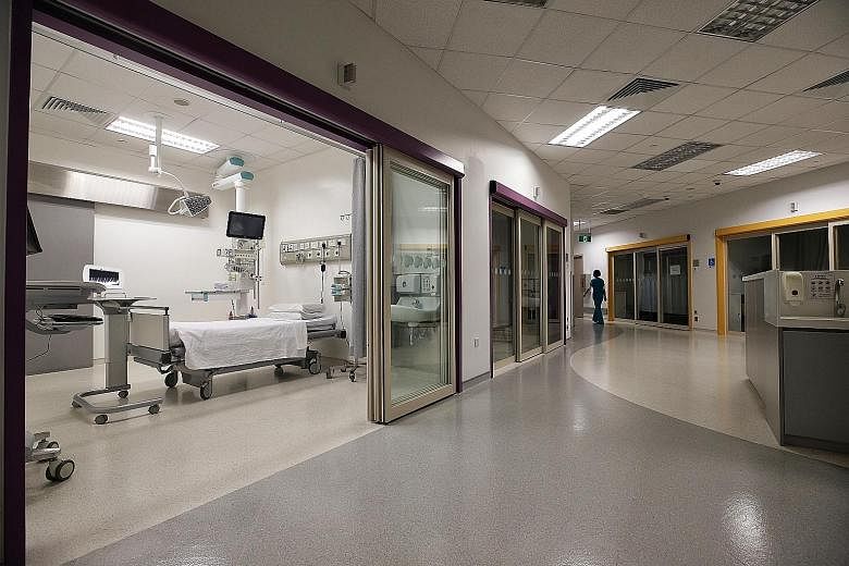 Just half of Farrer Park Hospital's 23 beds in the intensive care unit (above) are opened. The hospital currently has about 60 per cent occupancy.