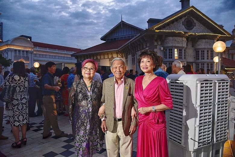 Former World War II bomber pilot Ho Weng Toh, 99, who flew for Malayan Airways, Malaysia-Singapore Airlines and Singapore Airlines, flanked by former air stewardesses Eunice Chua (left), 76, and Dolly Tan Soo Phin, 74, at the reunion at the Singapore