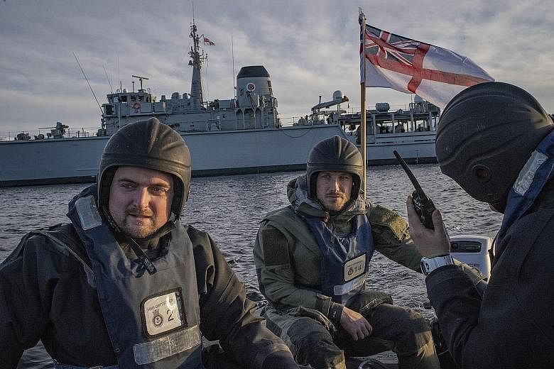 Sailors from the Royal Navy's HMS Cattistock taking part in mine-sweeping exercises in Molde, Norway, on Oct 30, 2018. As Britain spends heavily on big-ticket items like nuclear-armed submarines and aircraft carriers, its military is no longer deemed