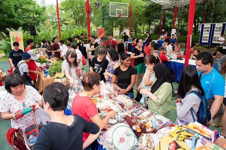 Residents taking part in an Earth Day fair at Nee Soon East on Saturday. Measures in the masterplan include setting up a chat group for residents to work together to share leftover food. By the year end, all leftover food at Nee Soon East events will