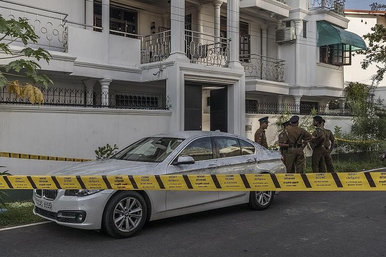 Police outside the Ibrahim mansion in Colombo, where the wife of Ilham Ibrahim, the son of one of Sri Lanka's wealthiest spice traders, set off a bomb, killing herself, her three children and three officers, last Tuesday. Mr Anders Holch Povlsen and 
