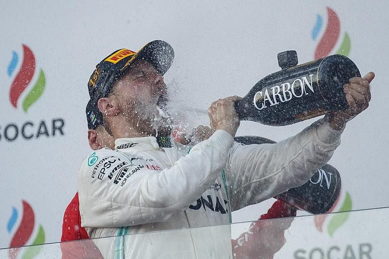 Mercedes' Valtteri Bottas celebrating his Azerbaijan Grand Prix win yesterday. He now leads the drivers' championship.