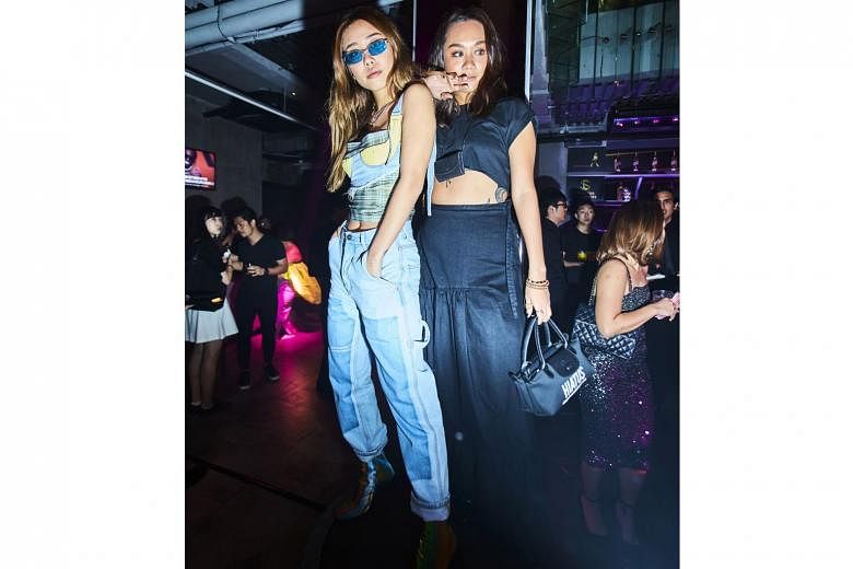 Surrender's creative manager Mae Tan (left) and public relations manager Guan Min (right) at the three-storey shophouse which was transformed into a 1970s-style nightclub.