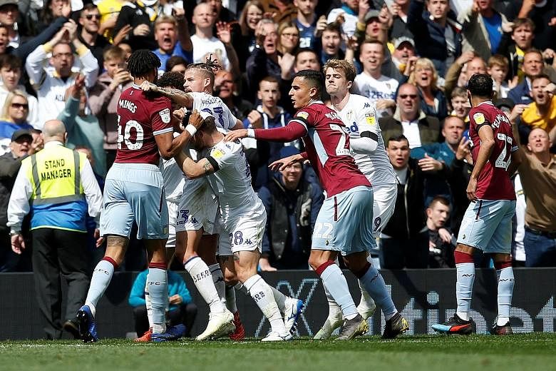 A controversial goal by Leeds' Mateusz Klich, scored while Aston Villa striker Jonathan Kodjia was injured, sparked a series of on-field melees among players from both teams at Elland Road on Sunday. PHOTO: REUTERS