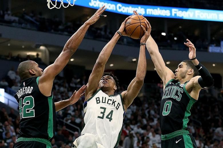 Giannis Antetokounmpo (centre) managed 22 points and eight rebounds but was powerless in the Milwaukee Bucks' surprise 112-90 home loss to the visiting Boston Celtics in Game 1 of the Eastern Conference semi-finals.