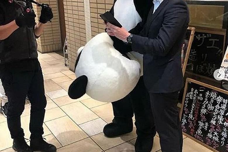 British singer Ed Sheeran stepped into a convenience store in Osaka wearing a panda outfit.