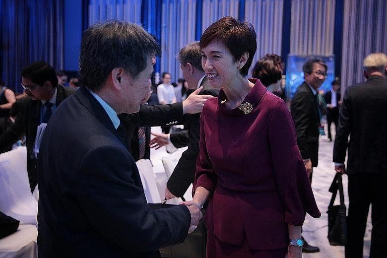 Manpower Minister Josephine Teo meeting Asean Secretary-General Lim Jock Hoi at the Singapore Conference on the Future of Work yesterday. About 700 international delegates are attending the conference, which ends today.