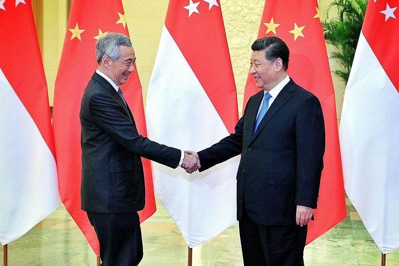 Prime Minister Lee Hsien Loong with Chinese President Xi Jinping at the Great Hall of the People in Beijing yesterday. PM Lee said Singapore has been preparing for a transition for a long time, getting younger ministers to actively engage China on va
