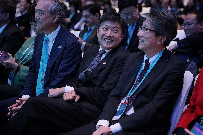 At the Singapore Conference on the Future of Work at Raffles City Convention Centre yesterday were (from left) Singapore National Employers Federation president Robert Yap, National Trades Union Congress secretary-general Ng Chee Meng and former manp