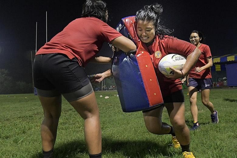 Ms Azurah Khalid at a rugby training session at Turf City last week. She has represented Singapore often in international women's rugby competitions, after recovering from a broken leg suffered during her first rugby game.