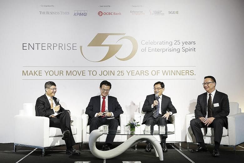 Finance Minister Heng Swee Keat (third from left) speaking at the launch of this year's Enterprise 50 Awards yesterday with (from left) Mr Ong Pang Thye, managing partner of KPMG Singapore; Mr Raymond Lim, associate director of Elmich; and Mr Toby Ko