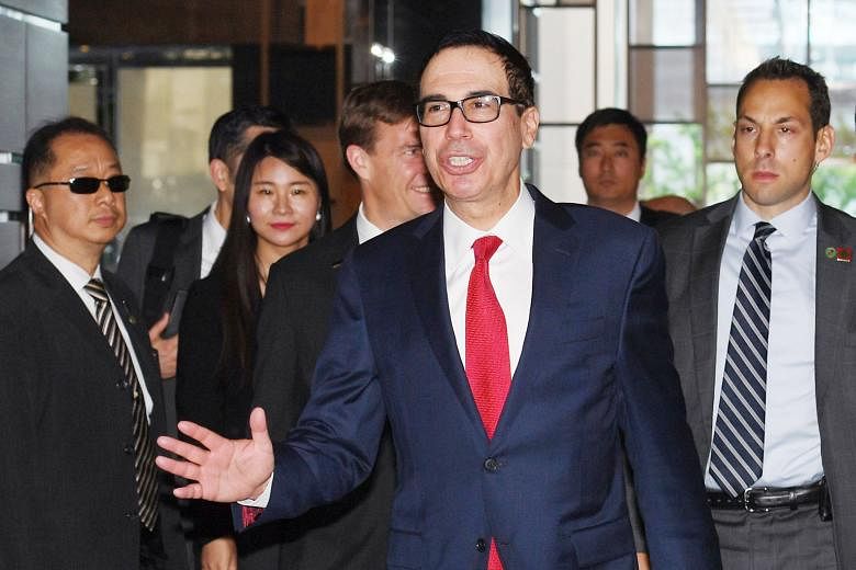 US Treasury Secretary Steven Mnuchin arriving at a hotel in Beijing yesterday ahead of trade talks with Chinese officials.