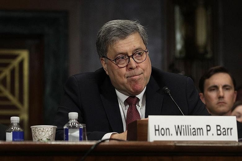 US Attorney-General William Barr testifying yesterday during a Senate hearing on the report by special counsel Robert Mueller (above) on Russian interference in the 2016 presidential election.