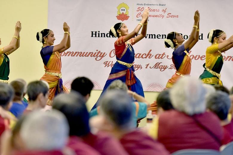 Dancers from Apsaras Arts dance group performing for the residents of Sunlove Home yesterday as part of the Hindu Endowments Board's celebration of its 50th anniversary. The board is marking the milestone by giving back to the community. Some members
