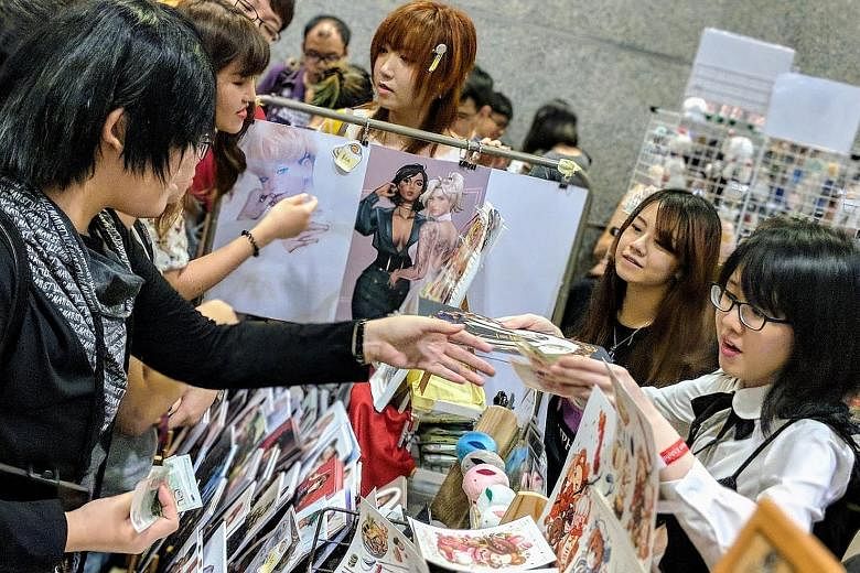 Fans at last year's Doujin Market here. More than 300 artists from 14 countries will take part in this year's event and it is expected to draw 20,000 people.