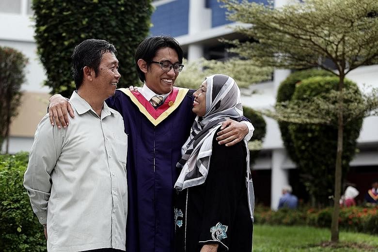 Lee Kuan Yew Award winner Shahreyll Khairoullah with his parents, Mr Khairoullah Shamsurie and Madam Aishah Mohamed, after his graduation ceremony at Nanyang Polytechnic yesterday.