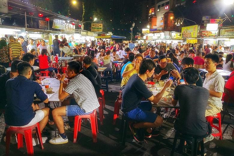 Hawker stalls at Penang's Gurney Drive waterfront. Penang state government's idea of Singapore and Malaysia filing a joint-nomination to list hawker culture under Unesco did not go down well with critics on both sides of the Causeway.