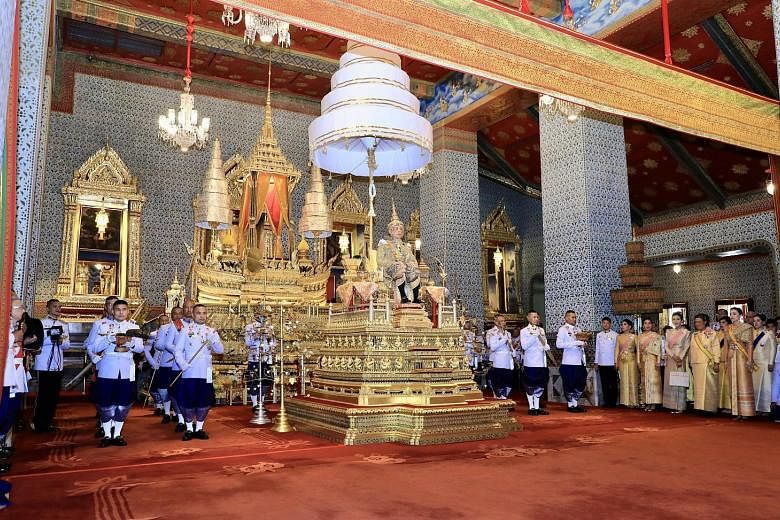 Members of the royal family at the coronation ceremony at the Grand Palace yesterday include (from left) the King's son, Prince Dipangkorn Rasmijoti, his daughters, Princess Sirivannavari Nariratana and Princess Bajrakitiyabha, his elder sister, Prin