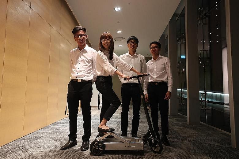The team of final-year students from the Mechanical Design Engineering programme - comprising (from left) Mr Liew Kar Quan, 23; Ms Wang Xin, 26; Mr Lim Jia Xin, 25; and Mr Chan Xinyin, 24 - with its human-powered scooter ScootMe!.
