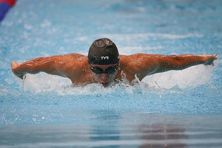 Toh Wei Soong competing in the 50m butterfly which he went on to win at the SPH Foundation National Inclusive Swimming Championships yesterday. ST PHOTOS: ONG WEE JIN