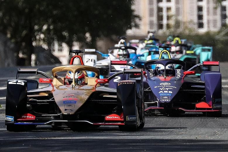 Formula E cars in Paris last month. Singapore is set to join a growing list of cities, like Paris and New York, in hosting the event. PHOTO: AGENCE FRANCE-PRESSE
