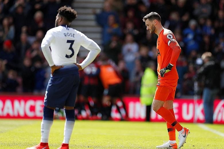 Tottenham goalkeeper Hugo Lloris and defender Danny Rose looking dejected after conceding in added time to lose 1-0 at Bournemouth in the Premier League last Saturday. PHOTO: REUTERS